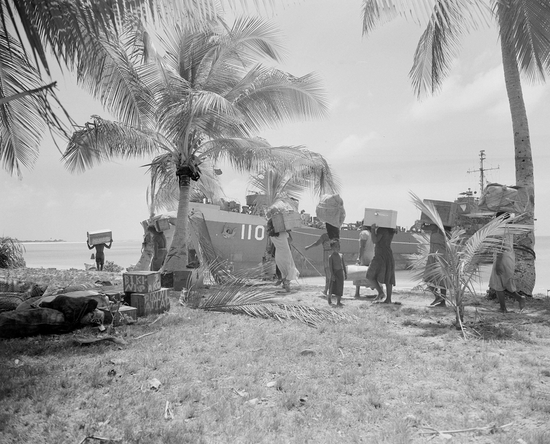 Residents of Bikini Atoll load their belongings onto an American LST for evacuation to Rongerik Atoll, 109 miles away.